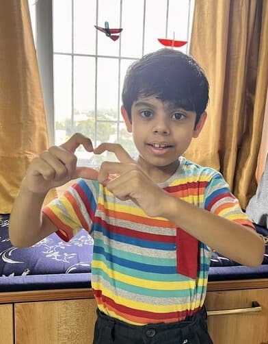 Little Sumo, Medhansh Sirohi (8), sharing heart gesture made by hands