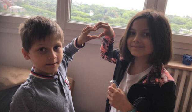 Little Sumos, Michelle (9) and Jay Arkadi Pandey (7), sharing heart gesture made by hands